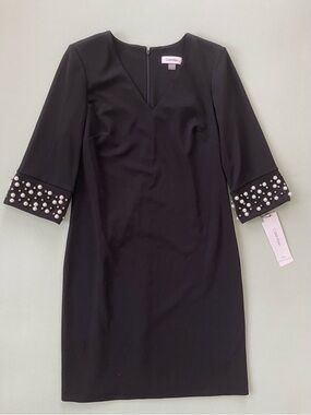 Calvin Klein Black V‑Neck Sheath Dress with Pearl Cuff Detail